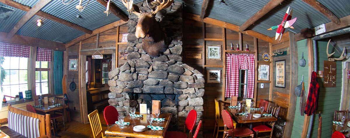 moose head over fireplace in camp dining room