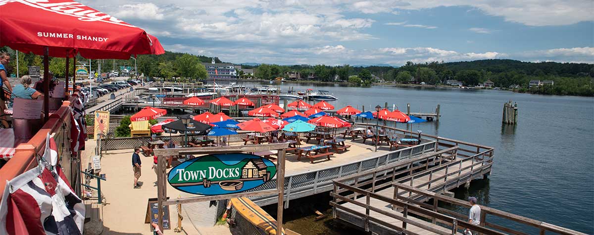 picnic tables outside at the dock overlooking lake at town docks restaurant