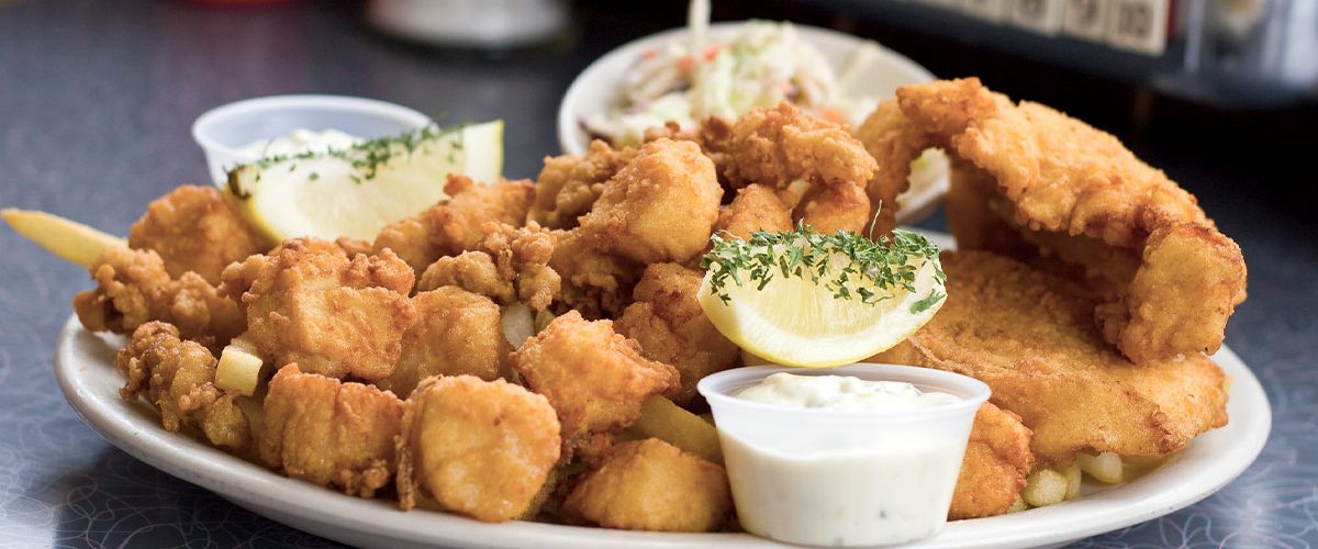 seafood platter on table in front of tabletop jukebox