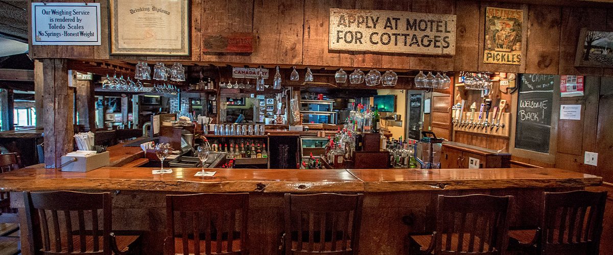 common man ashland bar with stools around it