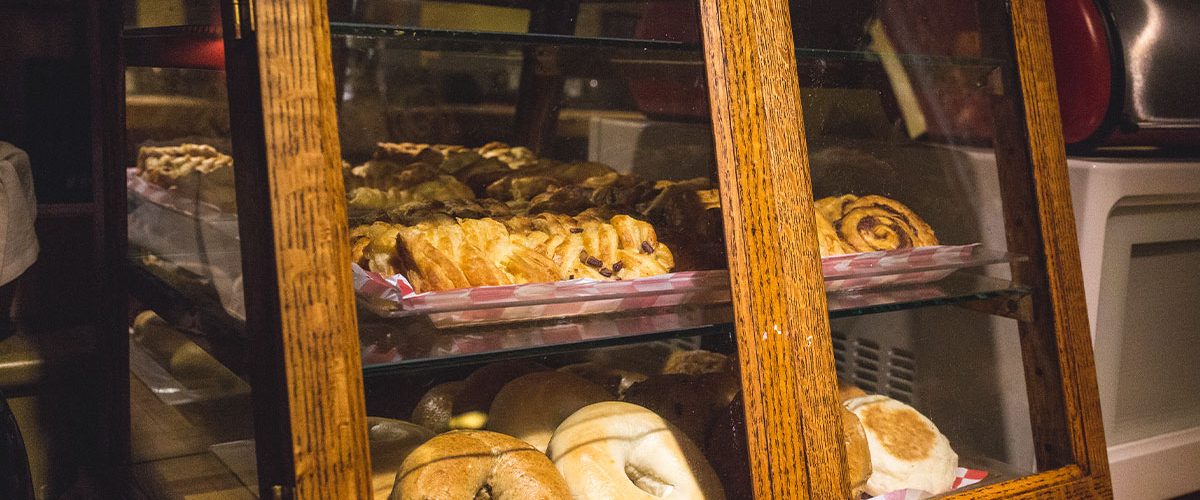 continental breakfast offerings of bagels and pastries in pastry cabinet