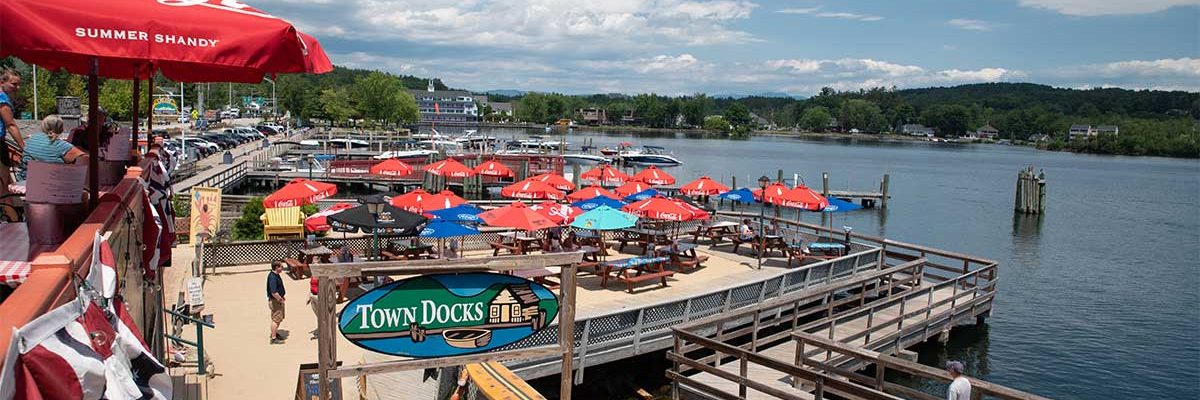 picnic tables outside at the dock overlooking lake at town docks restaurant